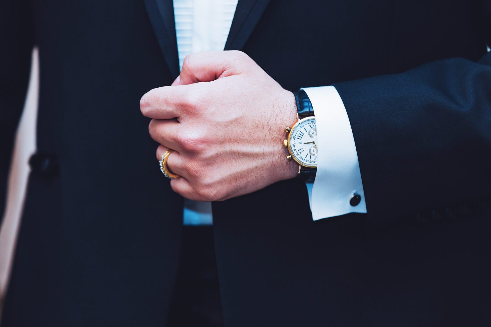 A close-up of the watch and suit of an injury lawyer in Baton Rouge.