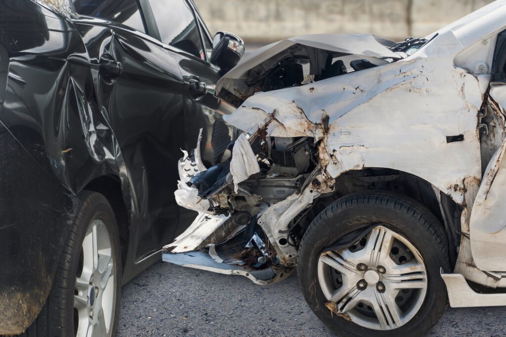 Close up of car crash damage on the road
